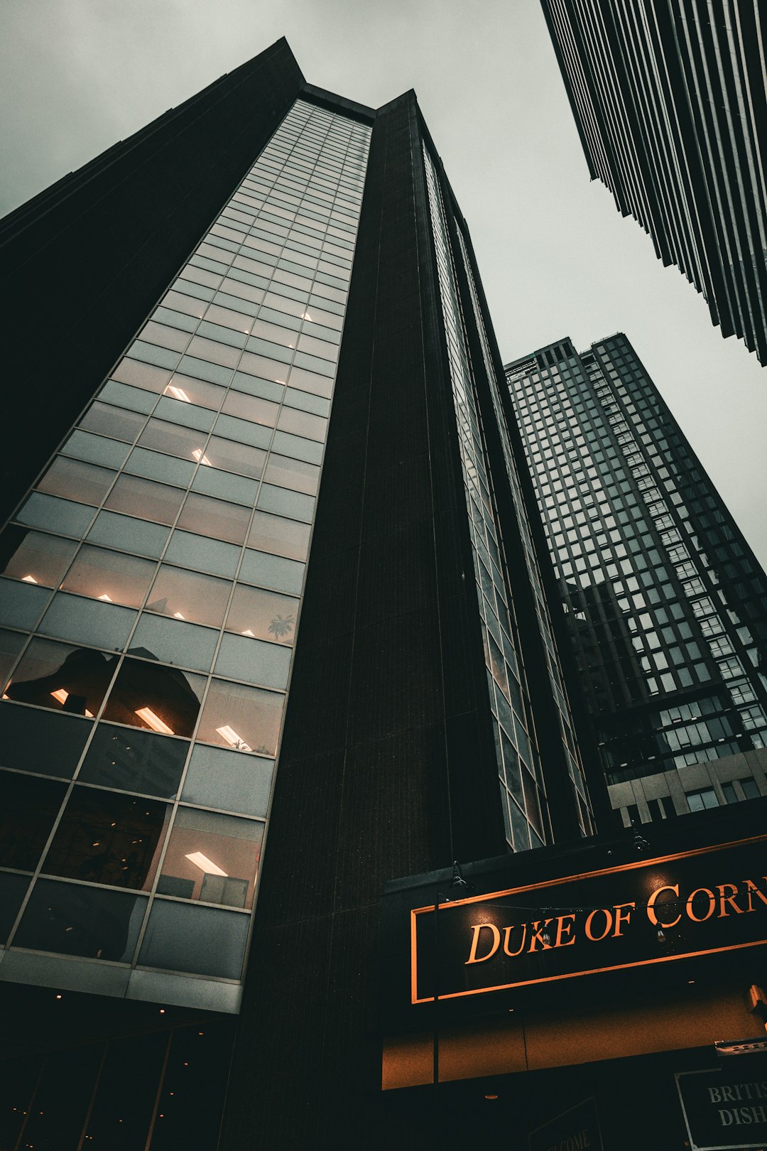 a-couple-of-tall-buildings-sitting-next-to-each-other-juirdbicxhk